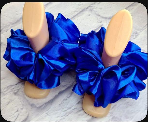 blue single color anklets on display stands elegant fashion accessory