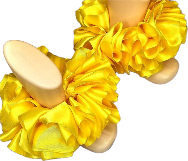 Single color yellow ruffled anklets on mannequin feet elegant accessory