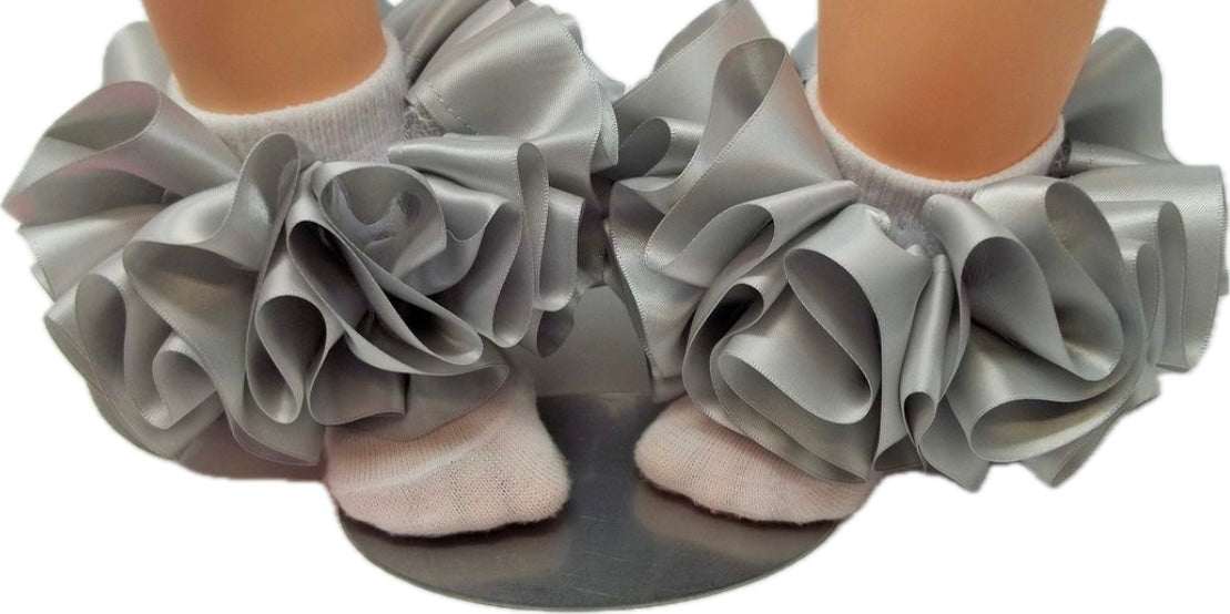 single color anklets with large silver fabric ruffles on feet with white socks