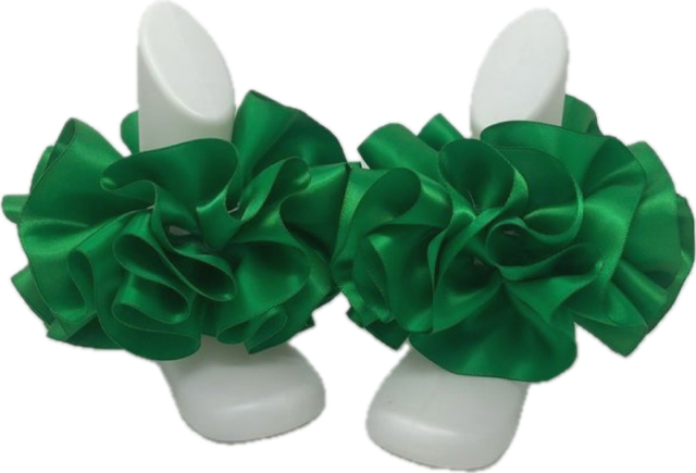 Green single color anklets with ruffled fabric design on white display stands