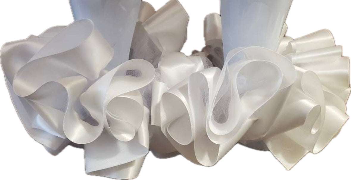 Close-up of elegant single color anklets with ruffled satin design for stylish accessory look